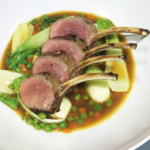 Lamb cutlets with peas, bacon and carrots