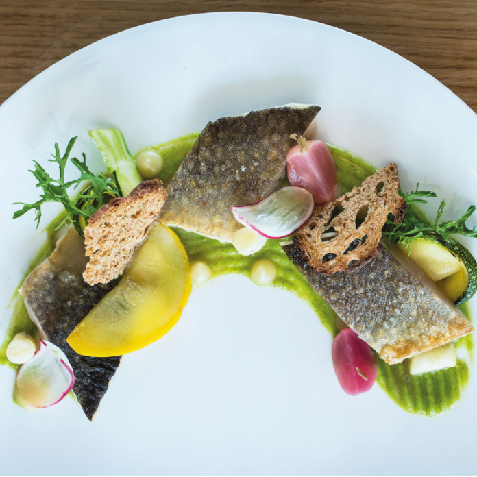 fish dish beautifully presented at le relais bernard loiseau