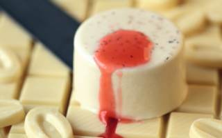 Tonka bean ivory panna cotta with strawberry coulis
