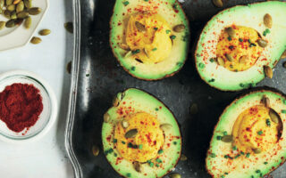 Healthy devilled avocado with squash seeds