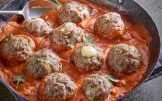 Comté-stuffed pork, beef and fennel meatballs in a tomato sauce