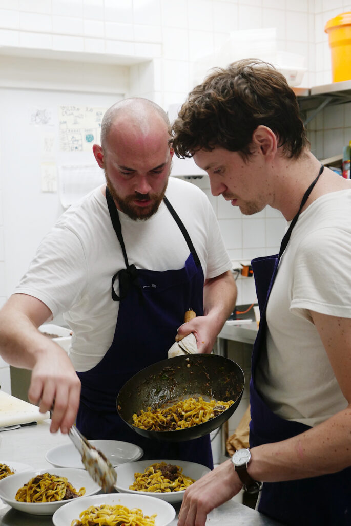 Chefs at le maquis making a Delicious dish 