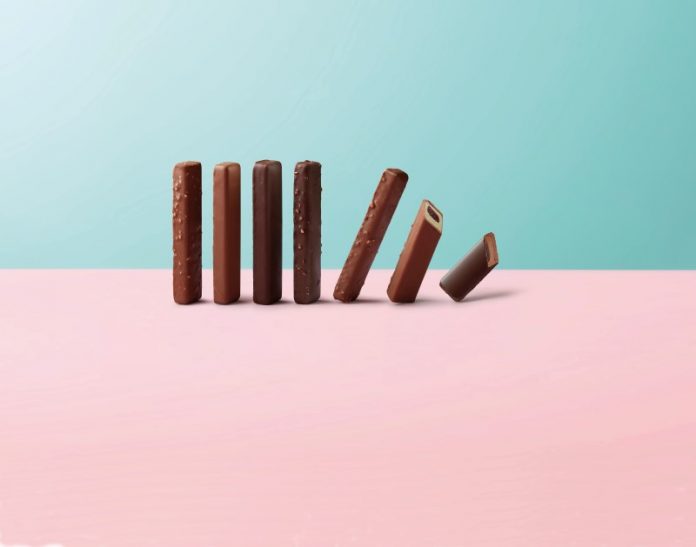 A line of chocolate sticks falling down