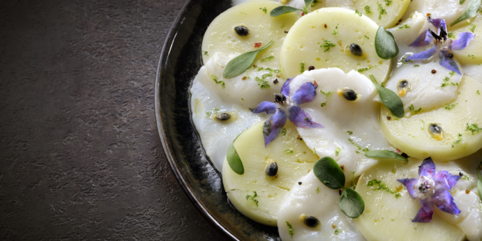 Carpaccio of scallops with Abondance cheese and passion fruit