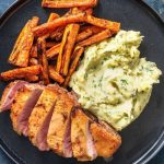 Duck à l'orange with parsley mash and roasted carrots