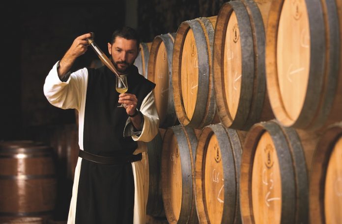 A monk making his wine