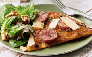 Morteau sausage tart, confit onions, comté cheese and juniper berries
