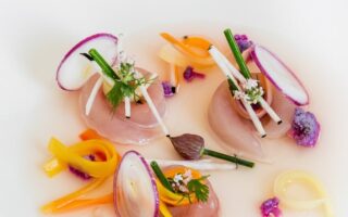 Mackerel served in a savoury lemon broth
