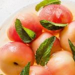 Vine peaches poached in green tea syrup with mint