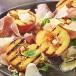 Burnt peaches with Comté, prosciutto and hazelnuts