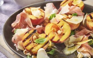 Burnt peaches with Comté, prosciutto and hazelnuts