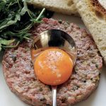 Traditional French Steak Tartare with egg yolk