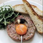 Traditional French Steak Tartare with egg yolk