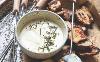 Roast Jerusalem artichokes with fondue-style cheese sauce