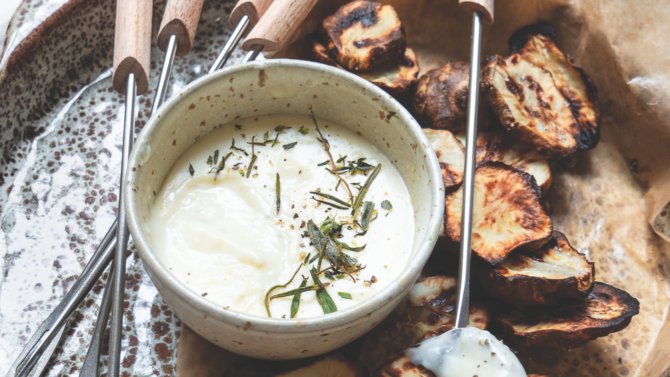 Roast Jerusalem artichokes with fondue-style cheese sauce