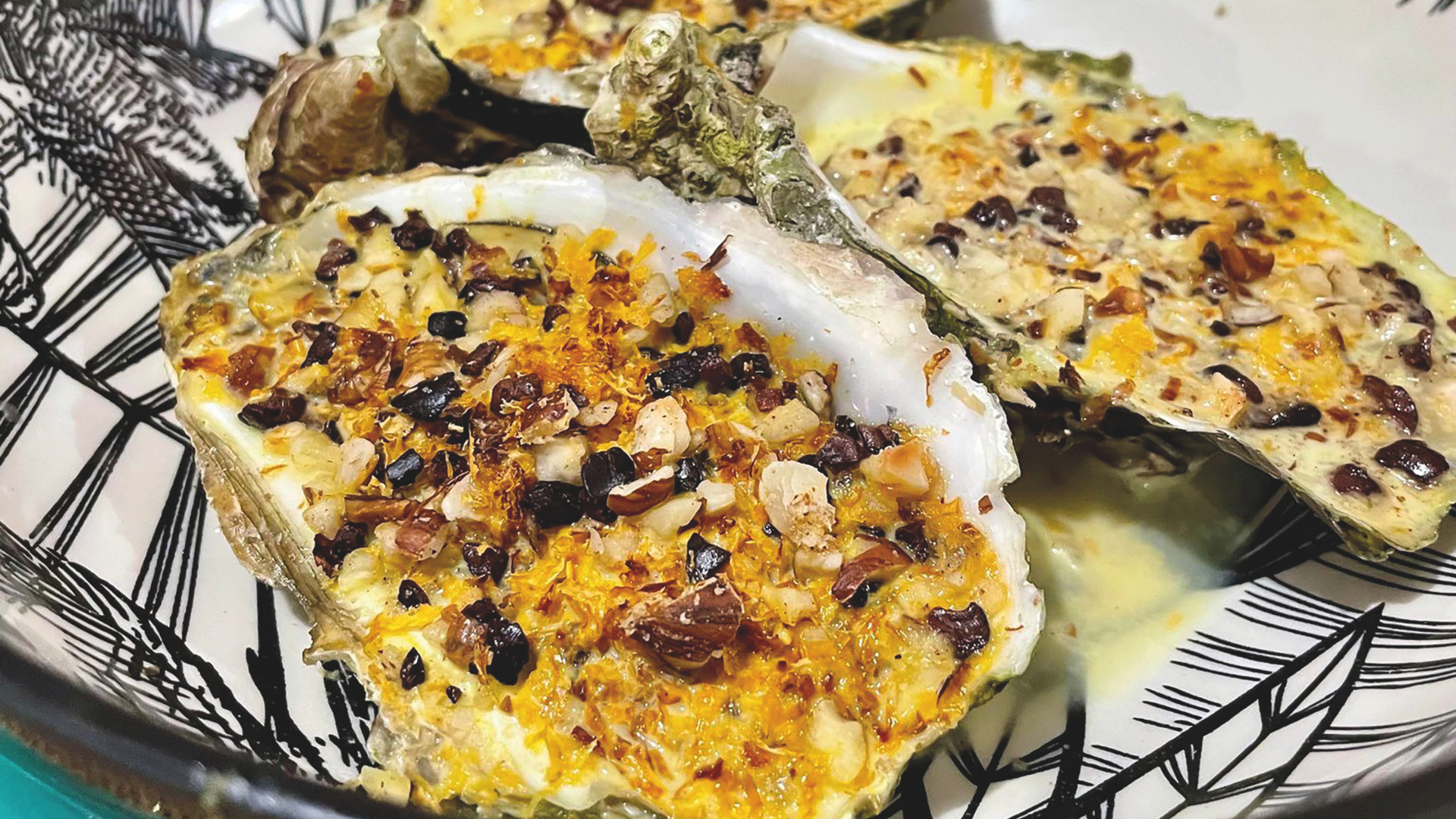 Oysters au gratin with cocoa nibs